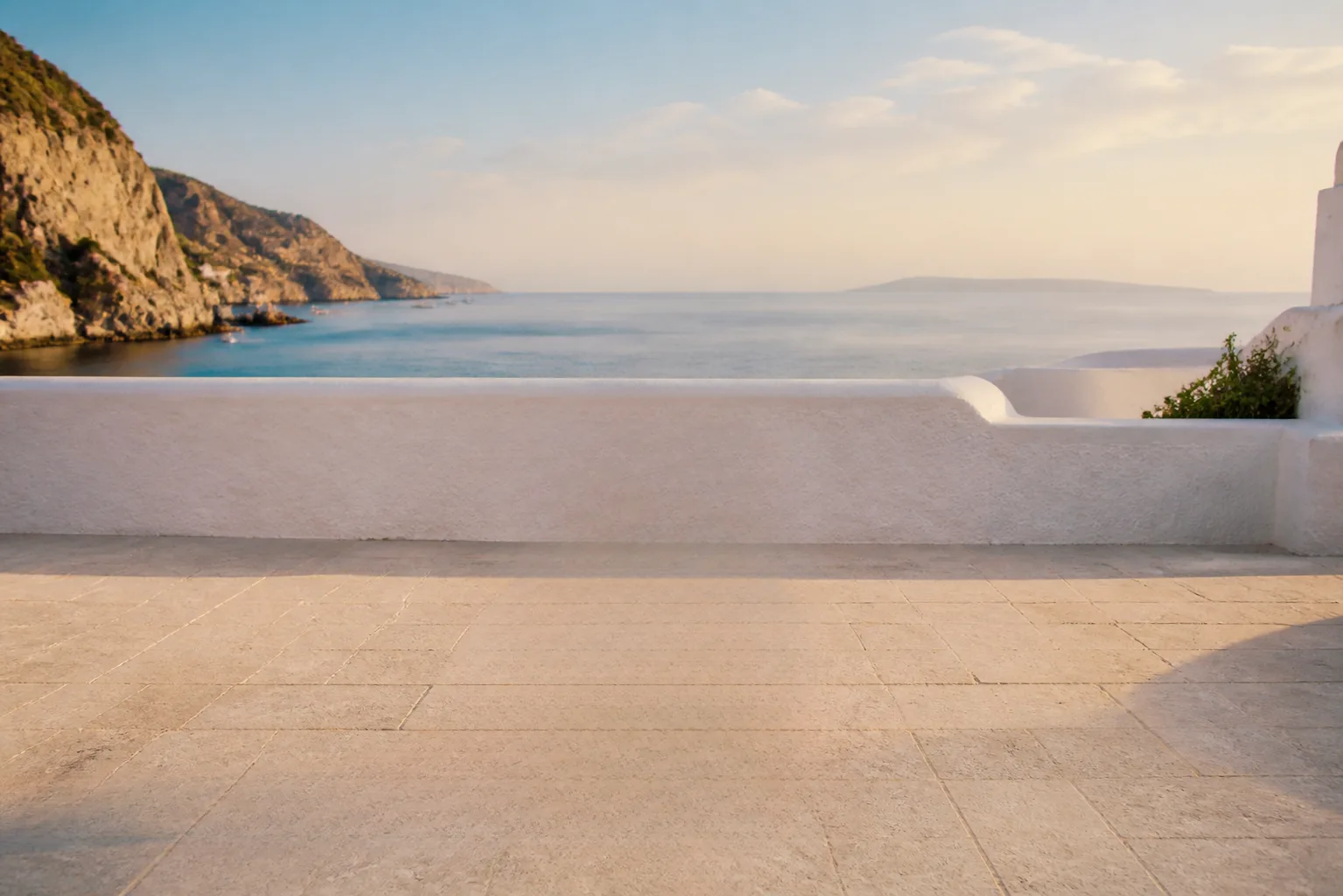 A clear Mediterranean terrace after the red chair and its shadow were removed